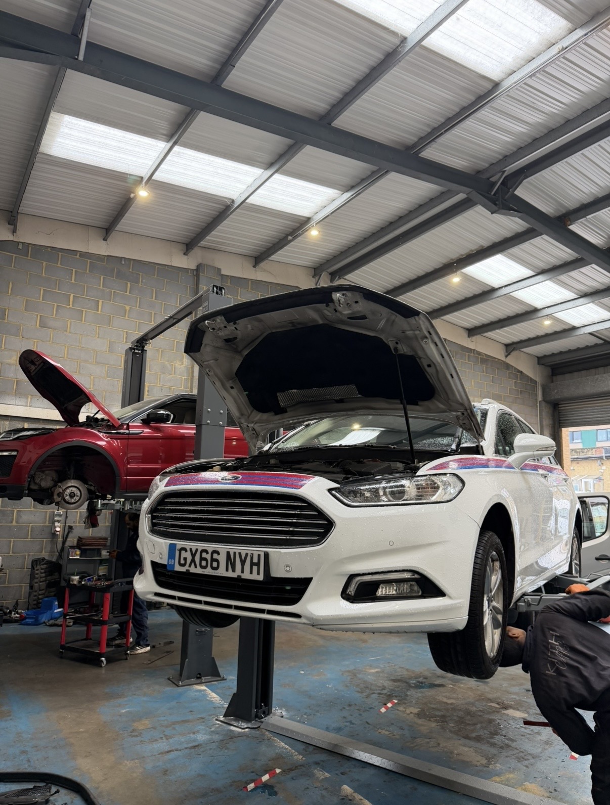 Diesel estate on the ramp for emissions system diagnosis at KITH Cars Garage & Bodyworks, Hackbridge